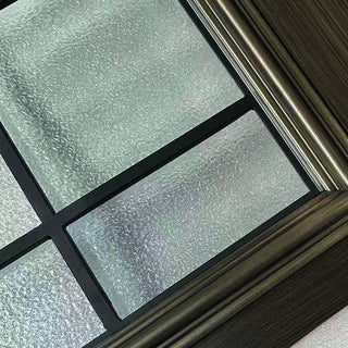 FRAMEWELL fiberglass door: pebbled frosted glass, black grilles, dark brush-stained frame, and metallic trim.