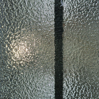 FRAMEWELL door's textured frosted glass with wrought iron grille, creating sparkling light diffusion and enhanced privacy.